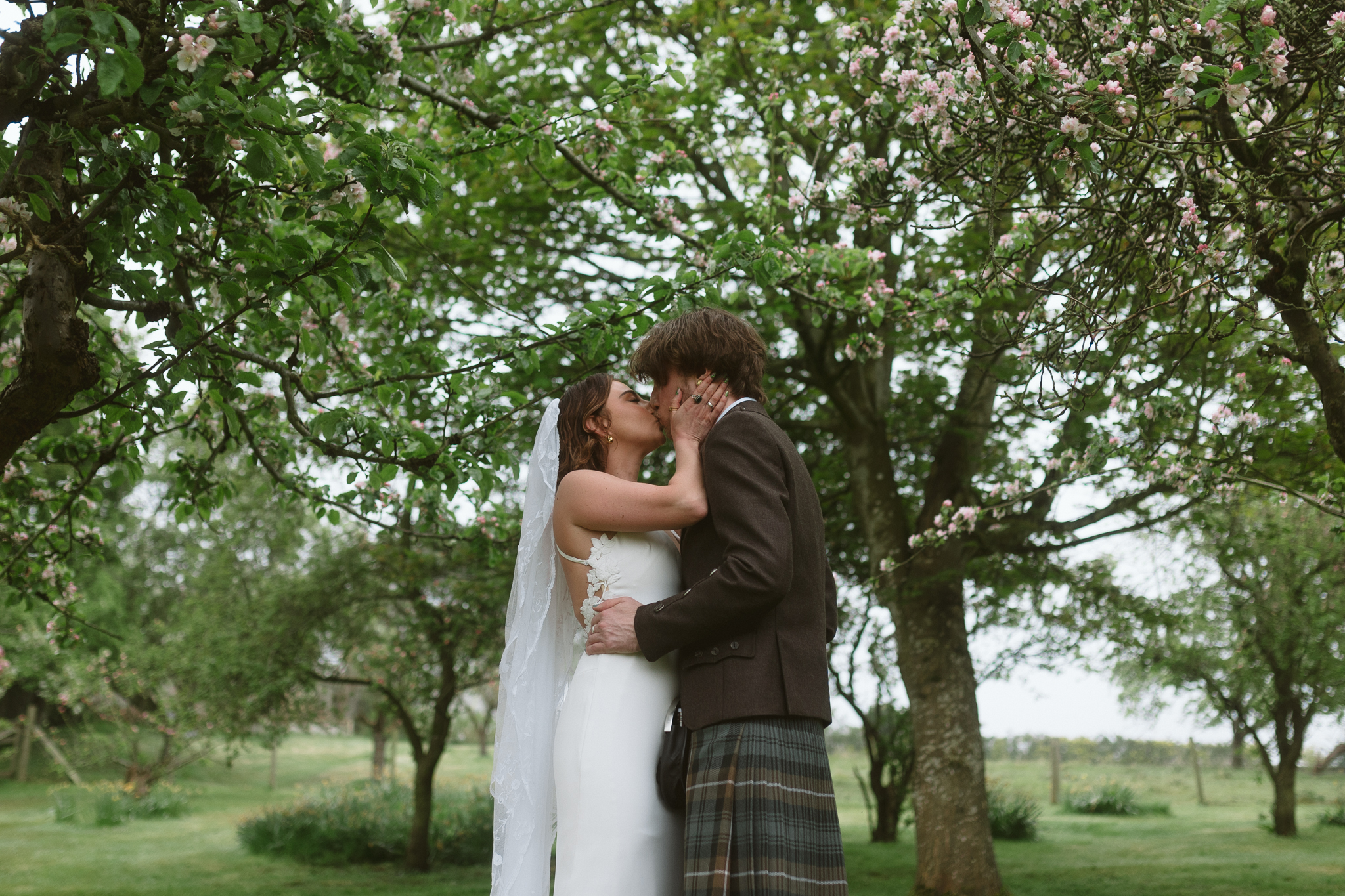 bride and groom kiss on wedding day