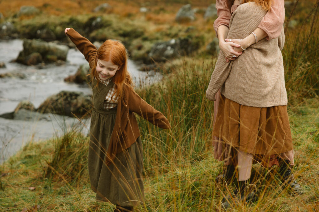 Dancing in winter outdoors with Aberdeenshire family photographer